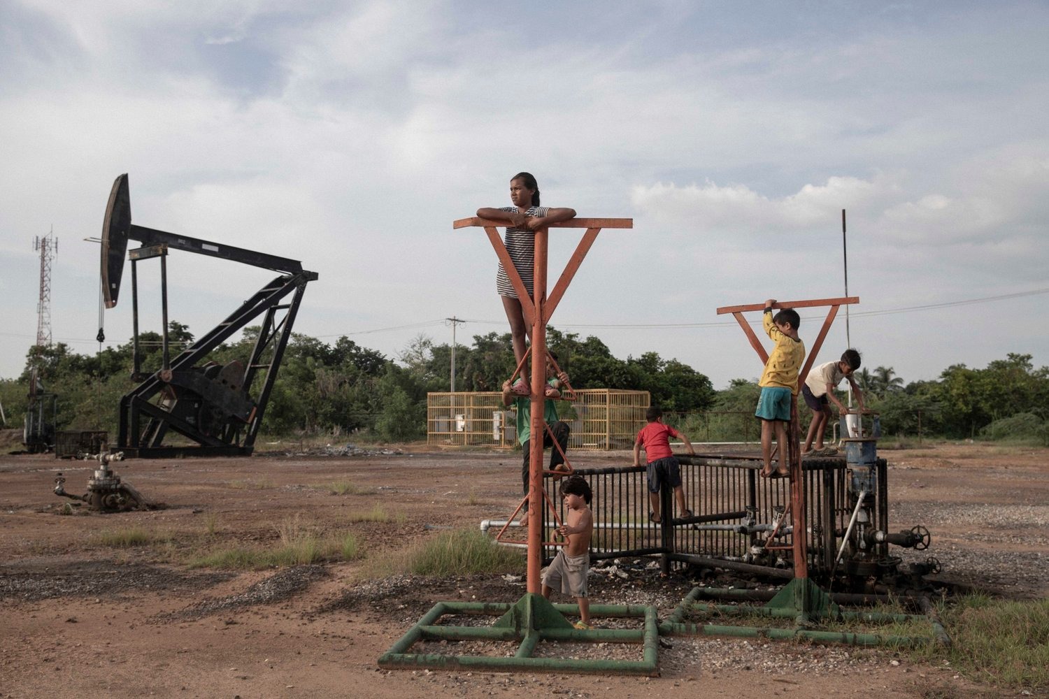 Image gallery Kids play on top on abandoned oil structures from the series I Can’t Hear the Birds by Fabiola Ferrero