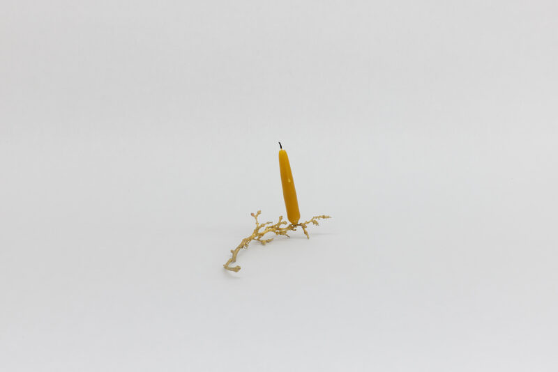 The candle is on the table