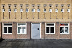 Four-Story, Flat-Roofed Complex in a Somewhat Expressionist Style