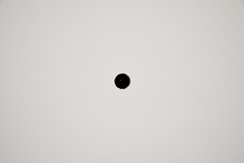 Like a hole in the wall where a picture used to hang